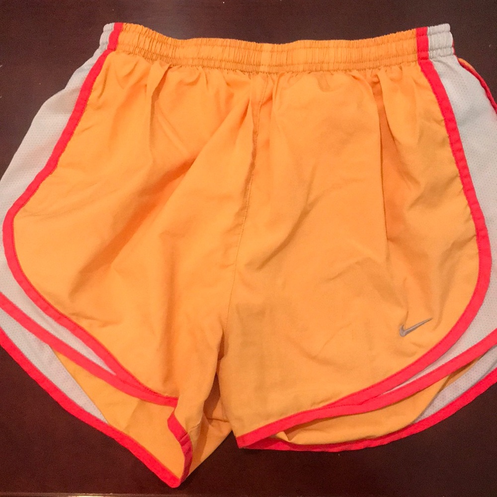 orange Nike tempos